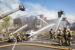 Several of the houses were engulfed in flames, a total of 13 were damaged and three dozen people were displaced. The losses from the May 2 blaze are estimated at $2.2 million. (Courtesy Brent Schnupp/Fairfax County Fire and Rescue
