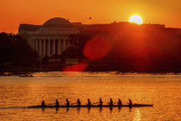 Rowers skim along the Potomac River as the sun rises over the Jefferson Memorial in Washington, Wednesday, May 2, 2018. The temperature in the Nation's Capitol is expected to reach into the upper 80's Wednesday as spring begins to give way to summer. (AP Photo/J. David Ake)