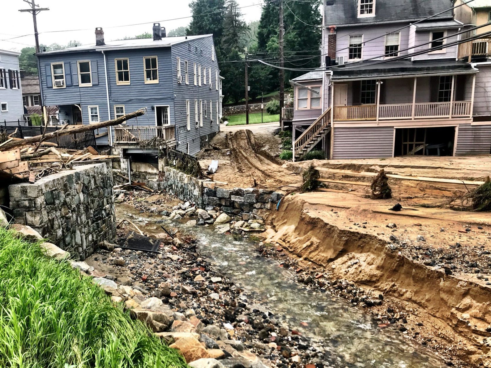 On a normal day, Tiber Creek flows right behind homes and businesses in Ellicott City, Maryland. (WTOP/Neal Augenstein)