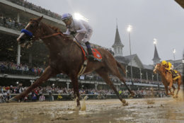 Mike Smith rides Justify to victory during the 144th running of the Kentucky Derby horse race at Churchill Downs Saturday, May 5, 2018, in Louisville, Ky. (AP Photo/Morry Gash)