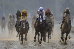 Mike Smith rides Justify to victory during the 144th running of the Kentucky Derby horse race at Churchill Downs Saturday, May 5, 2018, in Louisville, Ky. (AP Photo/Darron Cummings)