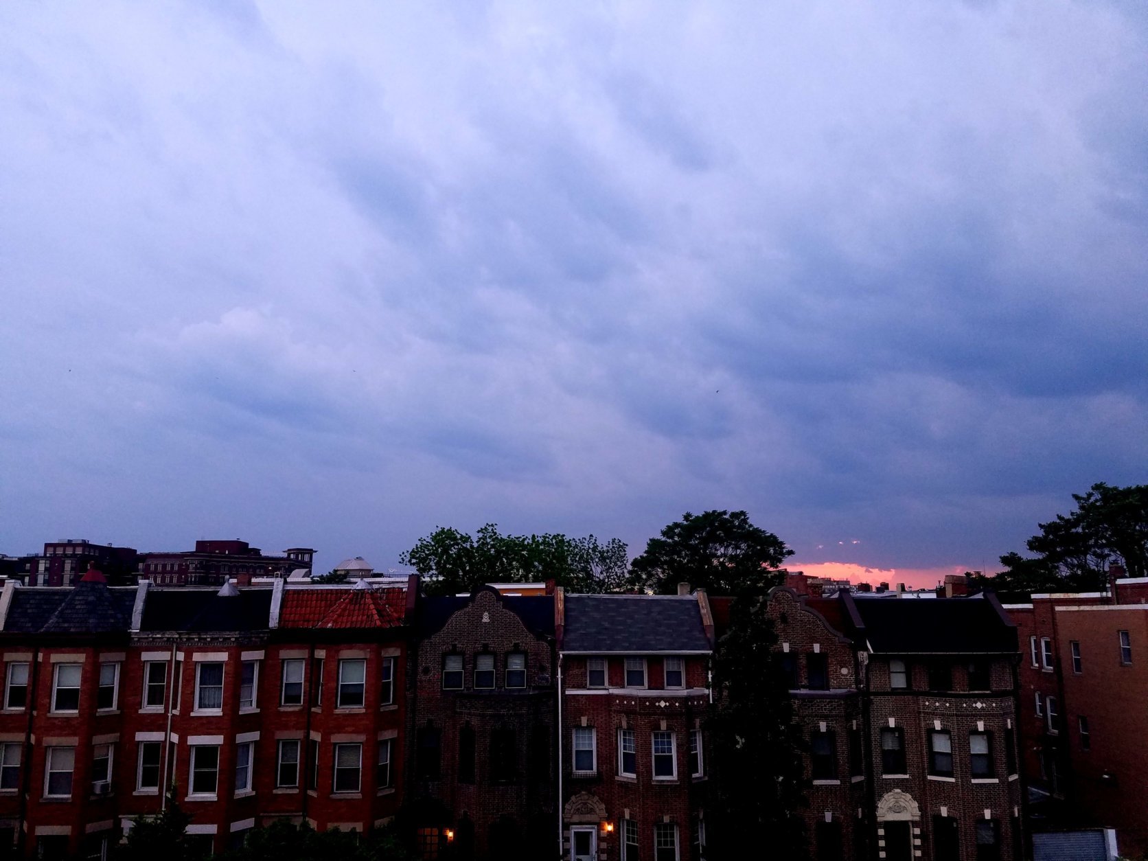 Dark clouds roll in over D.C.'s Columbia Heights neighborhood Tuesday evening. (WTOP/Will Vitka)