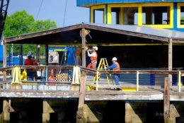Workers saw the roof support beams at the Cantina Marina on Tuesday, May 8 2018. (Courtesy Gina Genis)