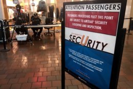 In a crowded corridor, passengers and shoppers walked by new portable screening equipment, which was being tested by Amtrak police, working with the Transportation Security Administration.(WTOP/Neal Augenstein)