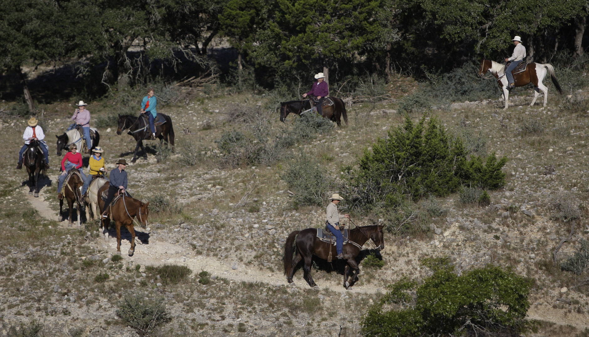 Visitors ride horses at the Dixie Dude Ranch near Bandera, Texas, Friday, Oct. 24, 2008.  (AP Photo/Eric Gay)