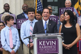 Baltimore County Executive Kevin Kamenetz announces he is joining the race for governor Monday, Sept. 18, 2017, in Towson, Md. Kamenetz is running in a crowded Democratic primary. From left are Kamenetz's sons, Dylan and Karson. His wife, Jill, is standing far right. (AP Photo/Brian Witte)