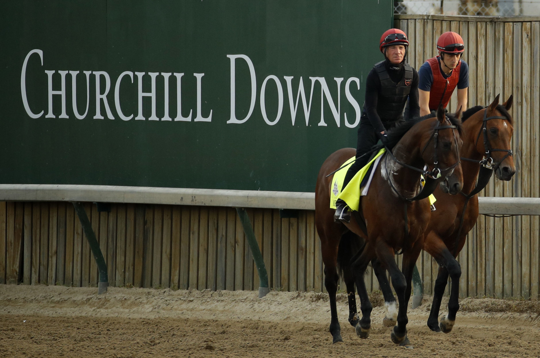 Kentucky Derby entrant Mendelssohn trains along with an outrider at Churchill Downs Thursday, May 3, 2018, in Louisville, Ky. The 144th running of the Kentucky Derby is scheduled for Saturday, May 5. (AP Photo/Charlie Riedel)