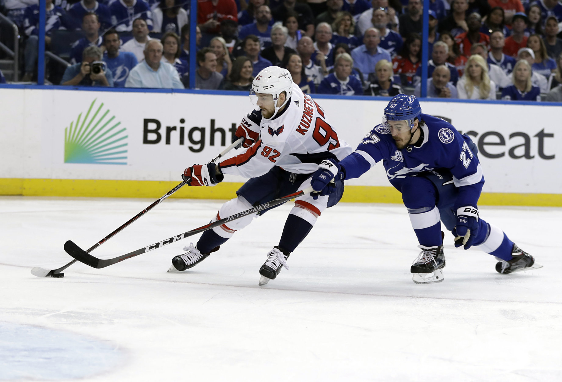 Washington Capitals center Evgeny Kuznetsov (92) moves the puck past Tampa Bay Lightning defenseman Ryan McDonagh (27) during the first period of Game 7 of the NHL Eastern Conference finals hockey playoff series Wednesday, May 23, 2018, in Tampa, Fla. (AP Photo/Chris O'Meara)