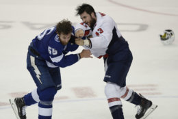 Tampa Bay Lightning defenseman Braydon Coburn (55) and Washington Capitals right wing Tom Wilson (43) fight during the first period of Game 7 of the NHL Eastern Conference finals hockey playoff series Wednesday, May 23, 2018, in Tampa, Fla. (AP Photo/Jason Behnken)