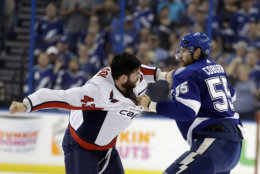 Tampa Bay Lightning defenseman Braydon Coburn, left, and Washington Capitals right wing Tom Wilson (43) fight during the first period of Game 7 of the NHL Eastern Conference finals hockey playoff series Wednesday, May 23, 2018, in Tampa, Fla. (AP Photo/Chris O'Meara)