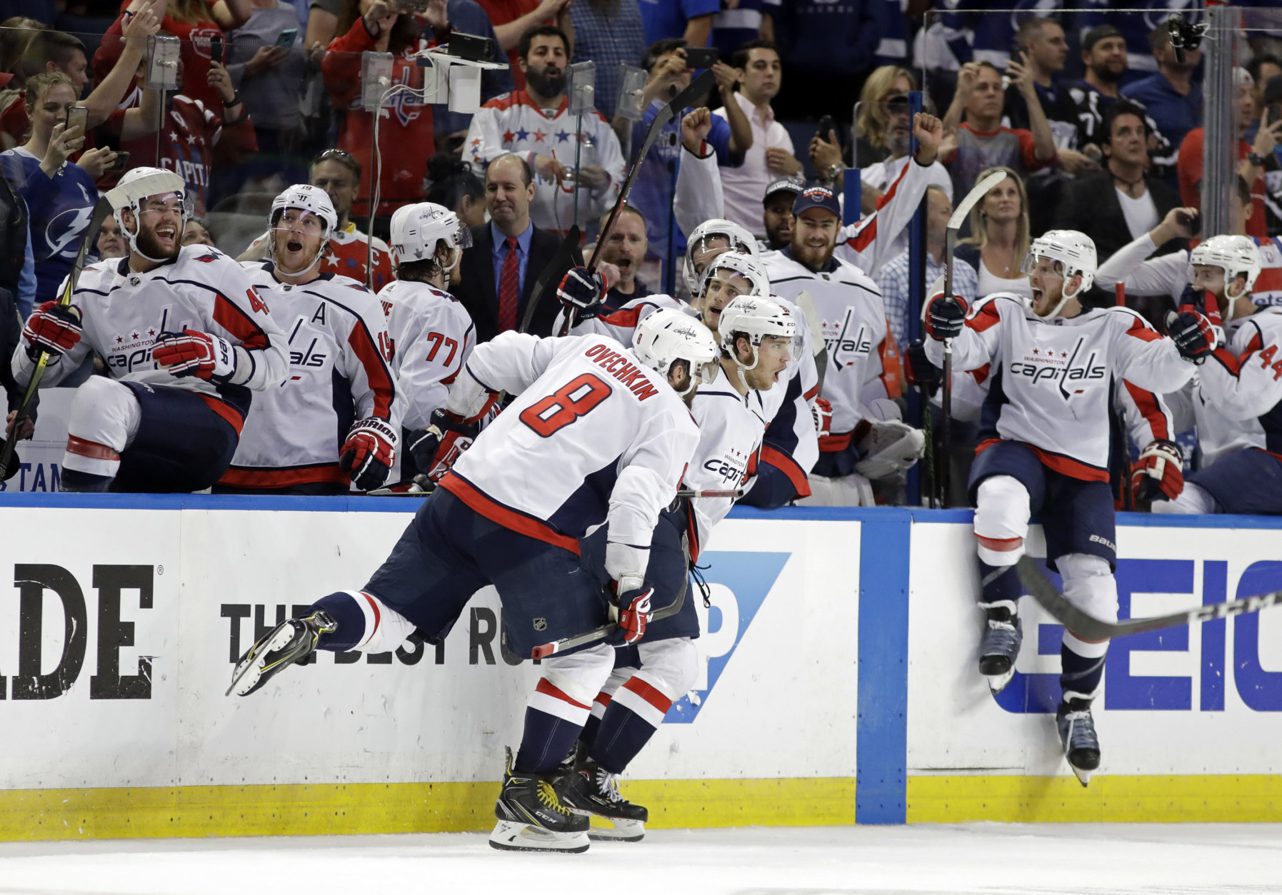 Washington Capitals, including left wing Alex Ovechkin (8). celebrate after defeating the Tampa Bay Lightning in Game 7 of the NHL Eastern Conference finals hockey playoff series Wednesday, May 23, 2018, in Tampa, Fla. (AP Photo/Chris O'Meara)