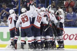 Washington Capitals celebrate after defeating the Tampa Bay Lightning 4-0 in Game 7 of the NHL Eastern Conference finals hockey playoff series Wednesday, May 23, 2018, in Tampa, Fla. (AP Photo/Chris O'Meara)