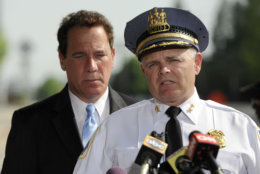 Baltimore County Police Chief Jim Johnson, right, speaks as Baltimore County Executive Kevin Kamenetz listens during a news conference outside WMAR-TV Tuesday, May 13, 2014, in Towson, Md. The officials announced that a man was taken into custody after allegedly crashing a vehicle into the television station. Kamenetz died of cardiac arrest at age 60 Thursday, May 10, 2018. (AP Photo/Steve Ruark)