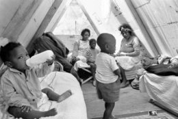 These Mississippians, including one-year-old Debbie Shirley with her nursing bottles made themselves at home in Resurrection City, Washington, May 22, 1968. In foreground is Michael Lee, 3. In background, from left, are: Francis Nunn of Crenshaw, Miss., Jerry Davis, 7, and Edith Maydukes of Marks, Miss. (AP Photo/Charles Tasnadi)