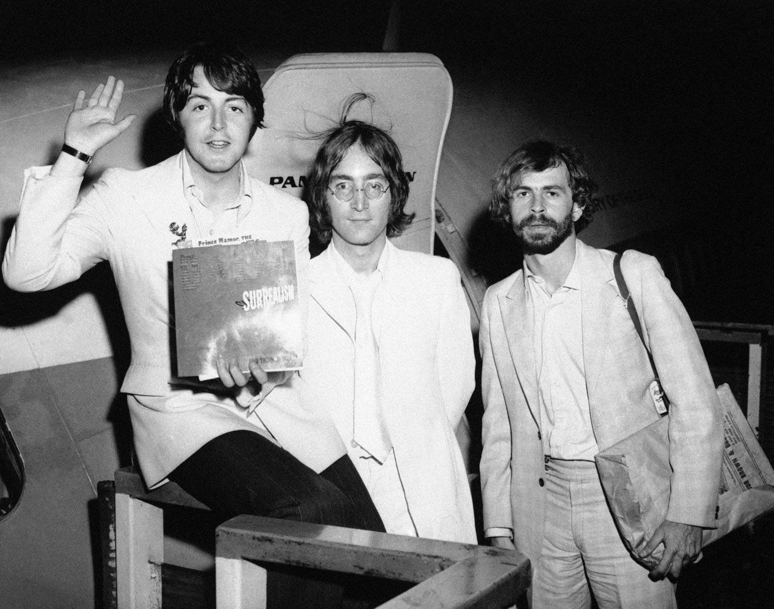 John Lennon, center, and Paul McCartney, left, member of the famed Beatles, announce in New York on May 14, 1968 that Beatles Ltd. is being reorganized for bigger things as Apple Corps. Ltd. (AP Photo)