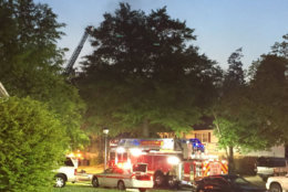 Crews try to put out a fire that killed one person in Beltsville, Maryland, on Saturday, May 12. (WTOP/John Domen)