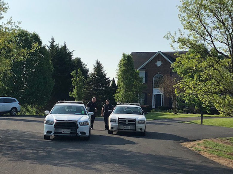 As of 8:25 a.m. on Tuesday, police were still on the scene of a triple murder in Brookeville, Maryland in Montgomery County. (WTOP/Melissa Howell)