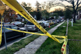 Police tape on the 4700 block of Omaha Street in Capitol Heights, Maryland. Police in Prince George's County said two people were found shot to death at a house in the block early Wednesday morning. (WTOP/Neal Augenstein)