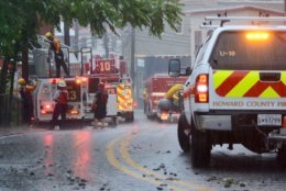 Emergency crews inspect an area during in Ellicott City on Sunday, May 27, 2018. (WTOP/Dave Dildine)