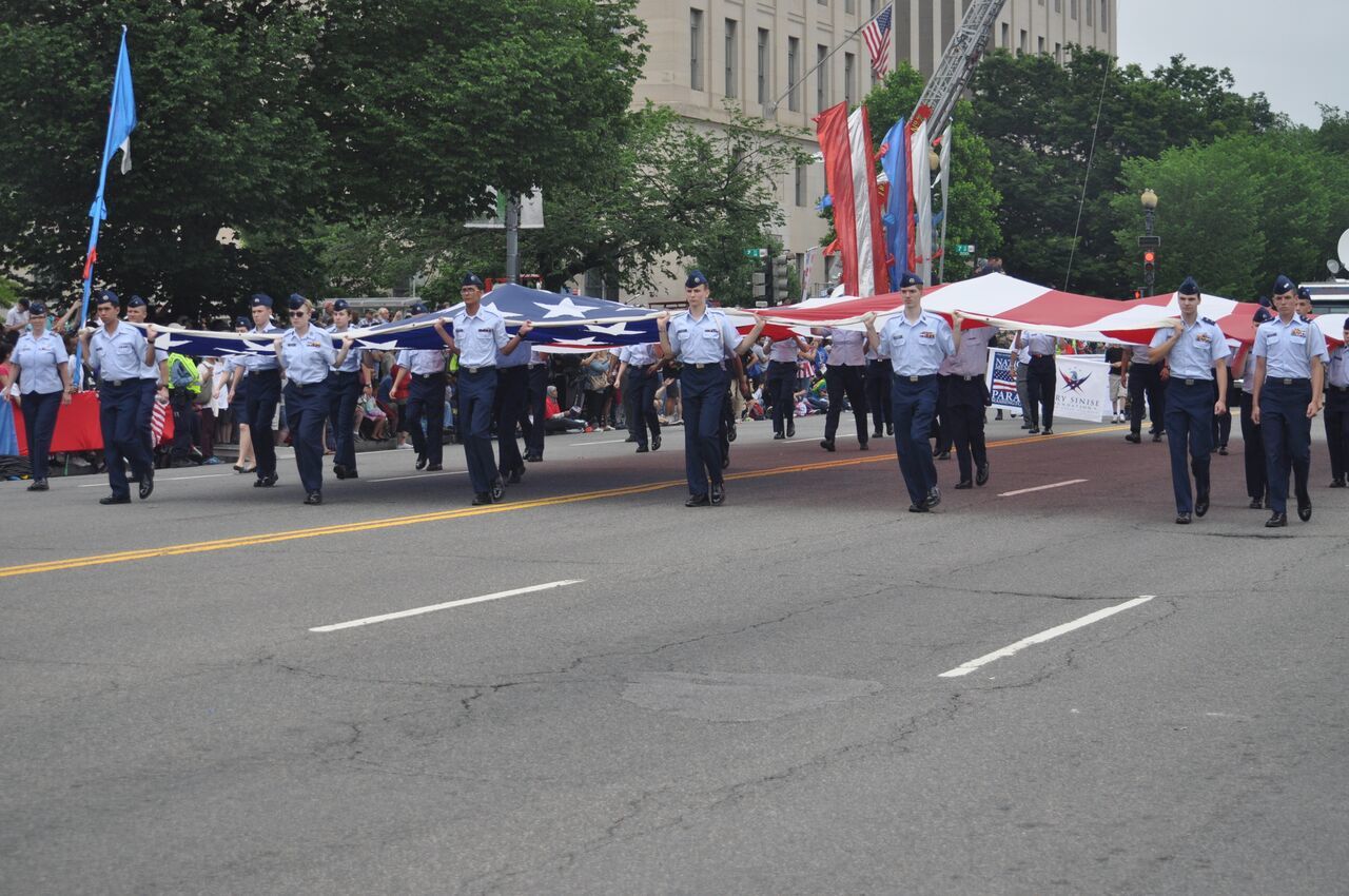 A flag is carried during the National Memorial Day Parade in D.C. on Monday, May 28, 2018. (Monique Blyther/WTOP)