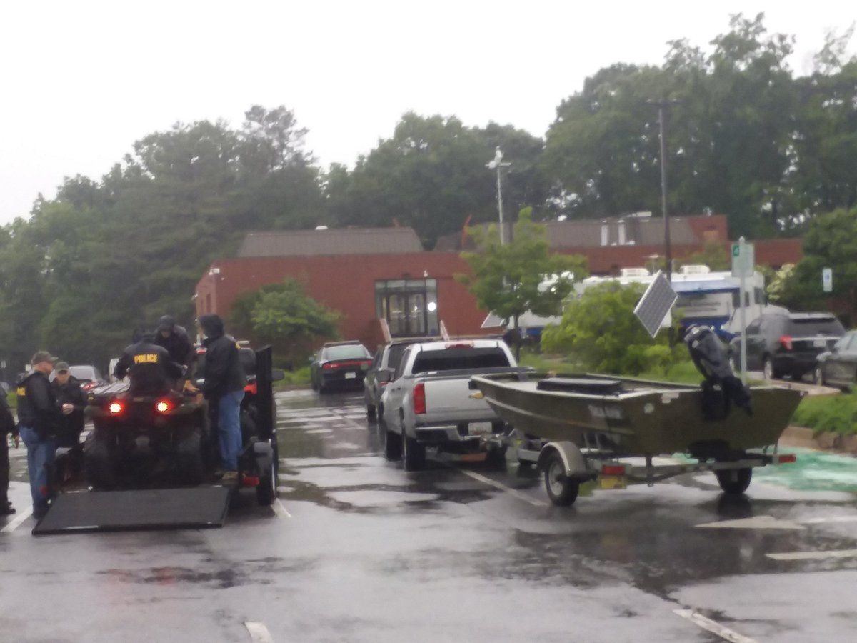 Maryland Natural Resources police stand by at the courthouse in Ellicott City, Md., with boats and ATVs for any potential water rescues on Sunday, May 27, 2018. (WTOP/Ralph Fox)