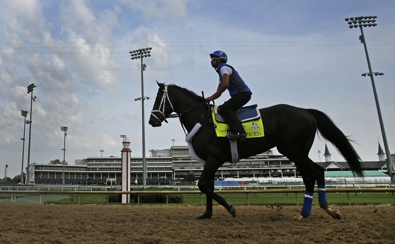 Kentucky Derby entrant Enticed runs during a morning workout at Churchill Downs Wednesday, May 2, 2018, in Louisville, Ky. The 144th running of the Kentucky Derby is scheduled for Saturday, May 5. (AP Photo/Charlie Riedel)