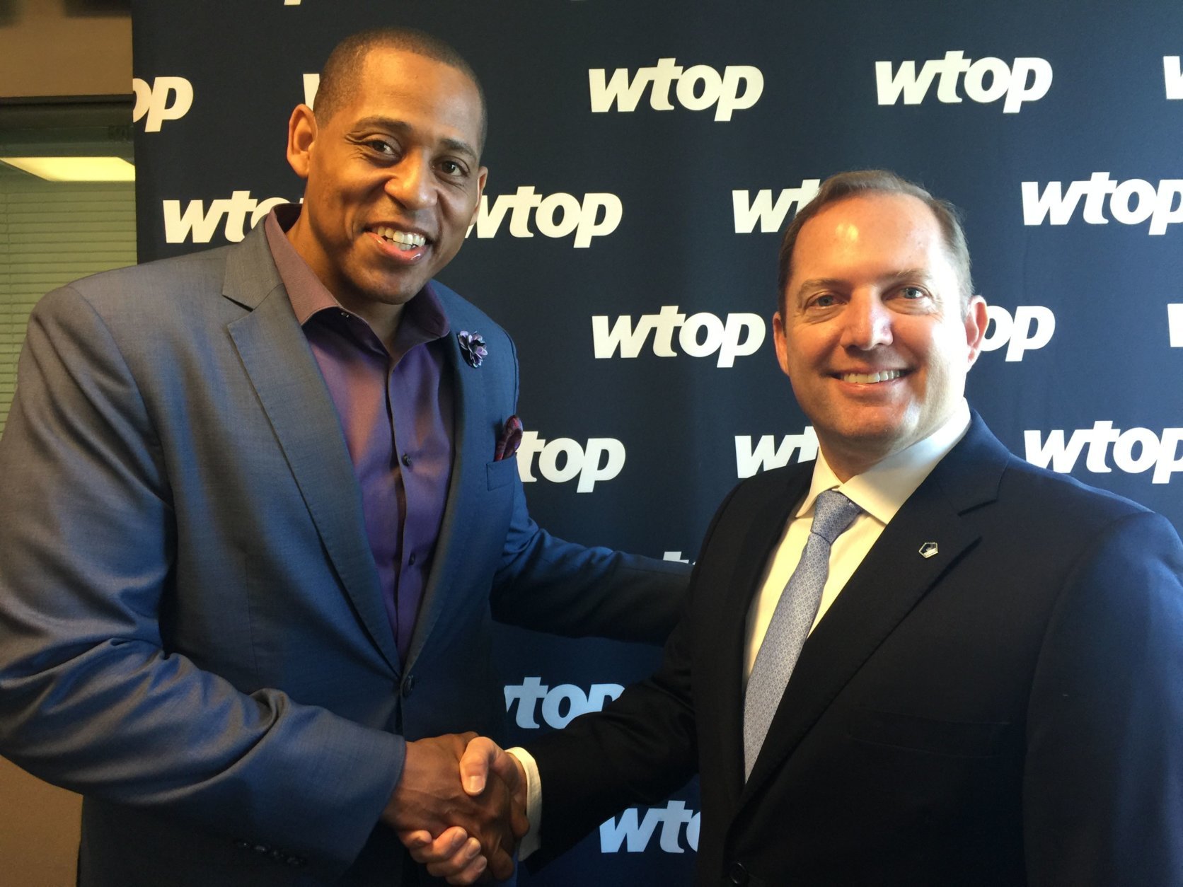 Retired U.S. Army Master Sgt. Cedric King, left, and PenFed Credit Union President and CEO James Schenck visit WTOP to talk about PenFed Foundation donations, what they fund for recipients, and what the contributions mean for military members and their families. (WTOP/Kristi King)

