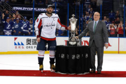 TAMPA, FL - MAY 23: Alex Ovechkin #8 of the Washington Capitals and NHL Deputy Commissioner Bill Daly pose with the Prince of Wales Trophy after defeating the Tampa Bay Lightning in Game Seven of the Eastern Conference Finals during the 2018 NHL Stanley Cup Playoffs at Amalie Arena on May 23, 2018 in Tampa, Florida. The Washington Capitals defeated the Tampa Bay Lightning with a score of 4 to 0. (Photo by Mike Carlson/Getty Images)