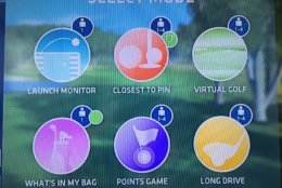 There are a variety of modes to work on your game, from simple shot tracking, to interactive games, to virtual golf on famous courses. (WTOP/Noah Frank)