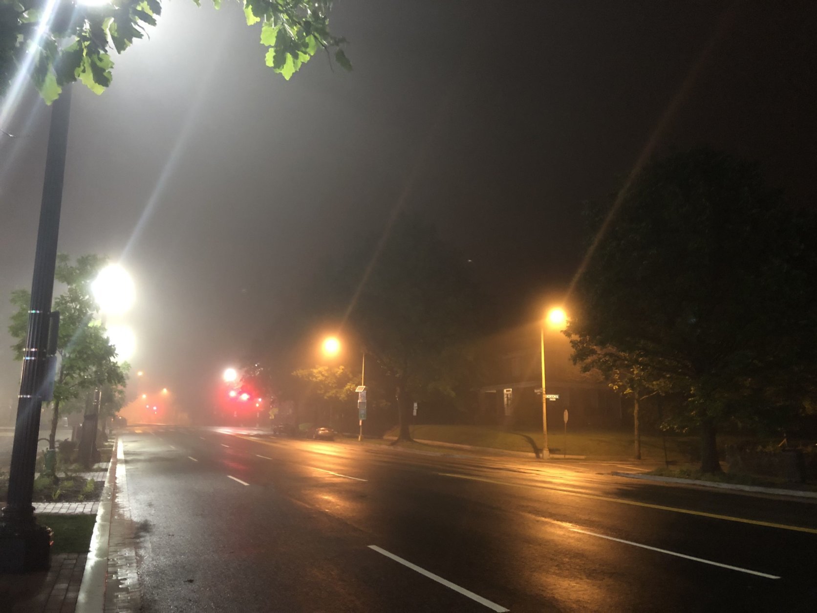 Fog obscures lights along Wisconsin Ave. in Northwest D.C. (WTOP/Abigail Constantino)