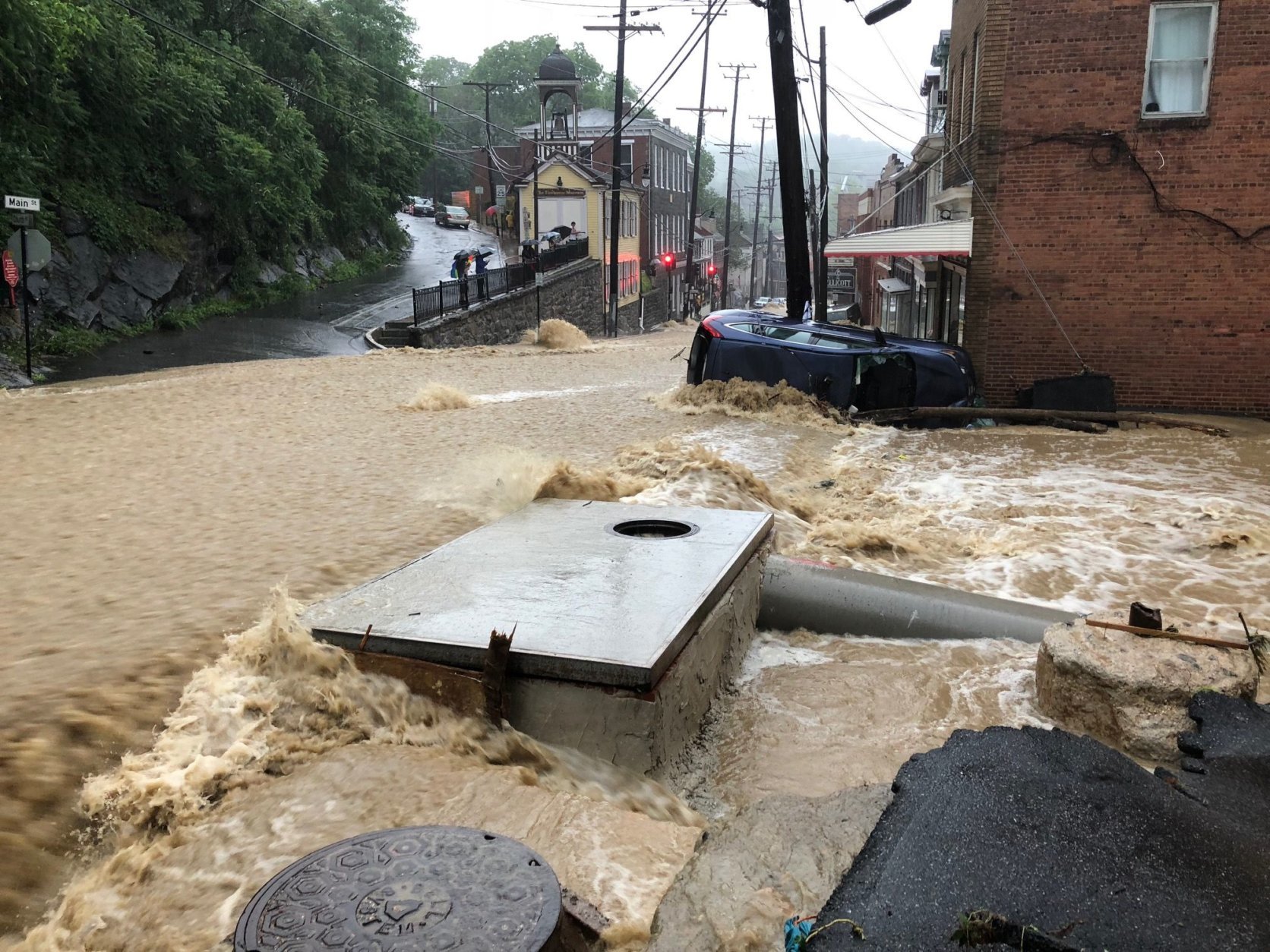 Flooding overtakes Main Street in Ellicott City, Maryland, after heavy rains and storms on Sunday, May 27, 2018. (WTOP/Dave Dildine)