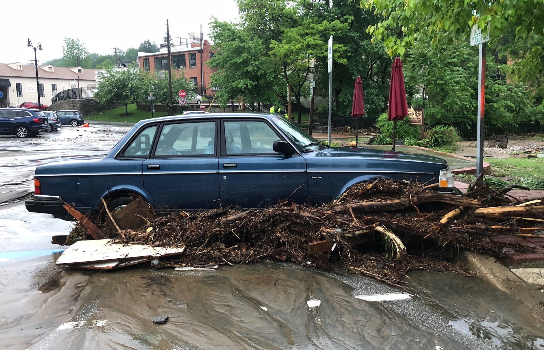 Debris runs through a car in Ellicott City on Sunday, May 27, 2018 during a flood. (WTOP/Dave Dildine)
