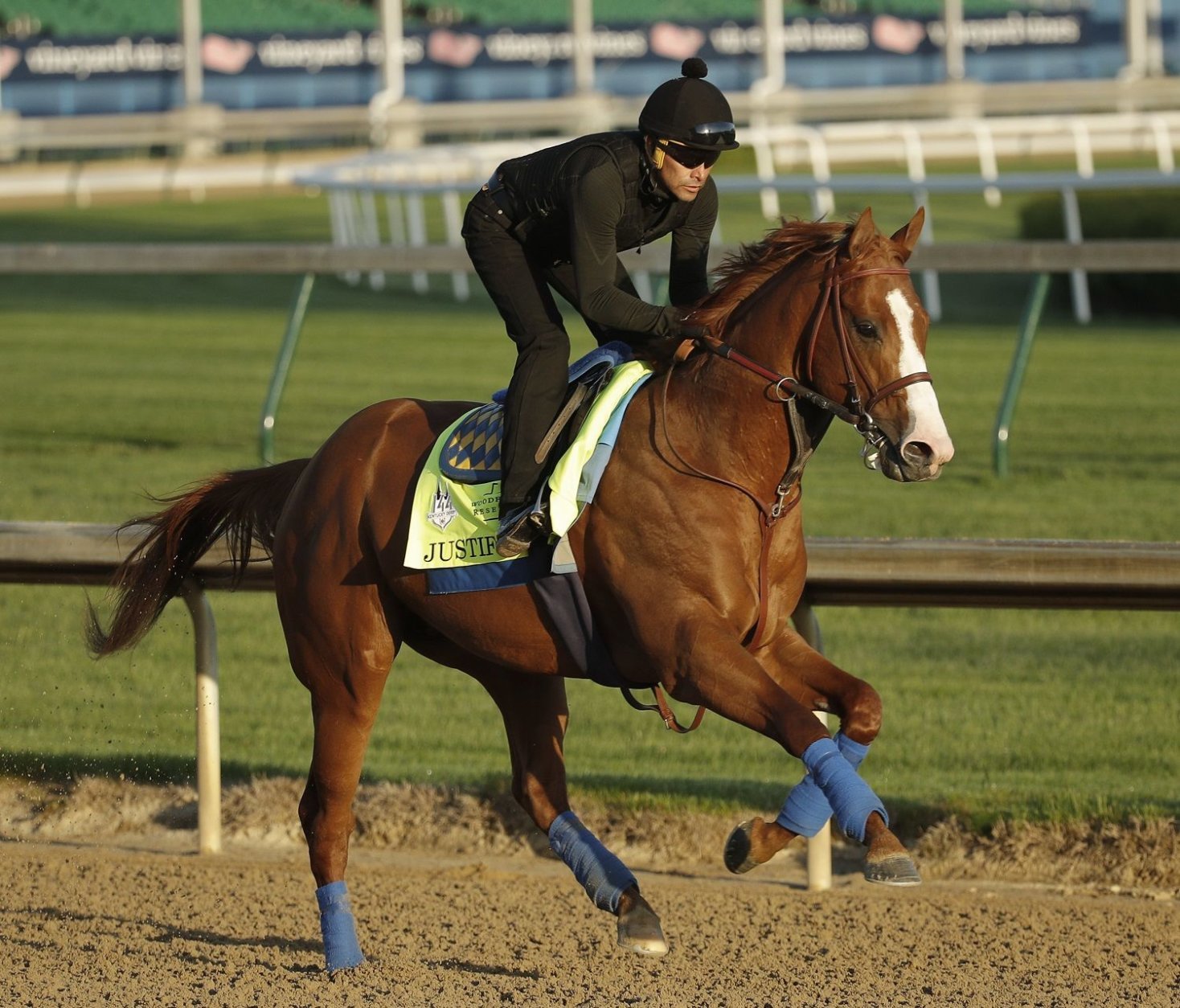 Kentucky Derby hopeful Justify runs during a morning workout at Churchill Downs Tuesday, May 1, 2018, in Louisville, Ky. The 144th running of the Kentucky Derby is scheduled for Saturday, May 5. (AP Photo/Charlie Riedel)