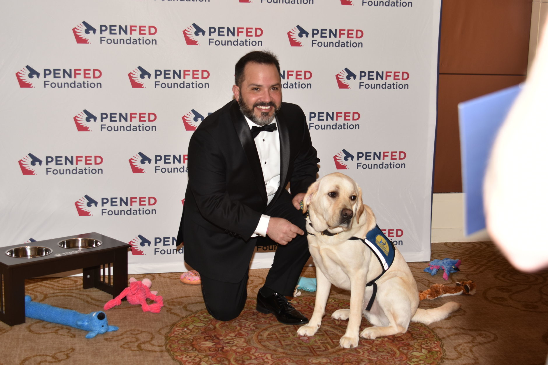 At the 2018 Night of Heroes Gala, Maj. Vincent Cerichone, of Springfield, Virginia, poses with his assistant dog, Taco, that he received through Canine Companions For Independence. It’s one of three organizations that train service dogs for veterans that each received $50,000 from the PenFed Foundation. (Courtesy PenFed)