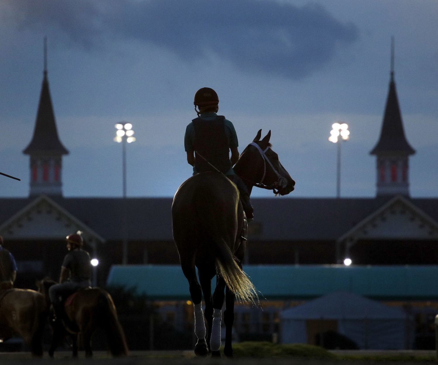 A horse heads onto the track for a morning workout at Churchill Downs Friday, May 4, 2018, in Louisville, Ky. The 144th running of the Kentucky Derby is scheduled for Saturday. (AP Photo/Charlie Riedel)