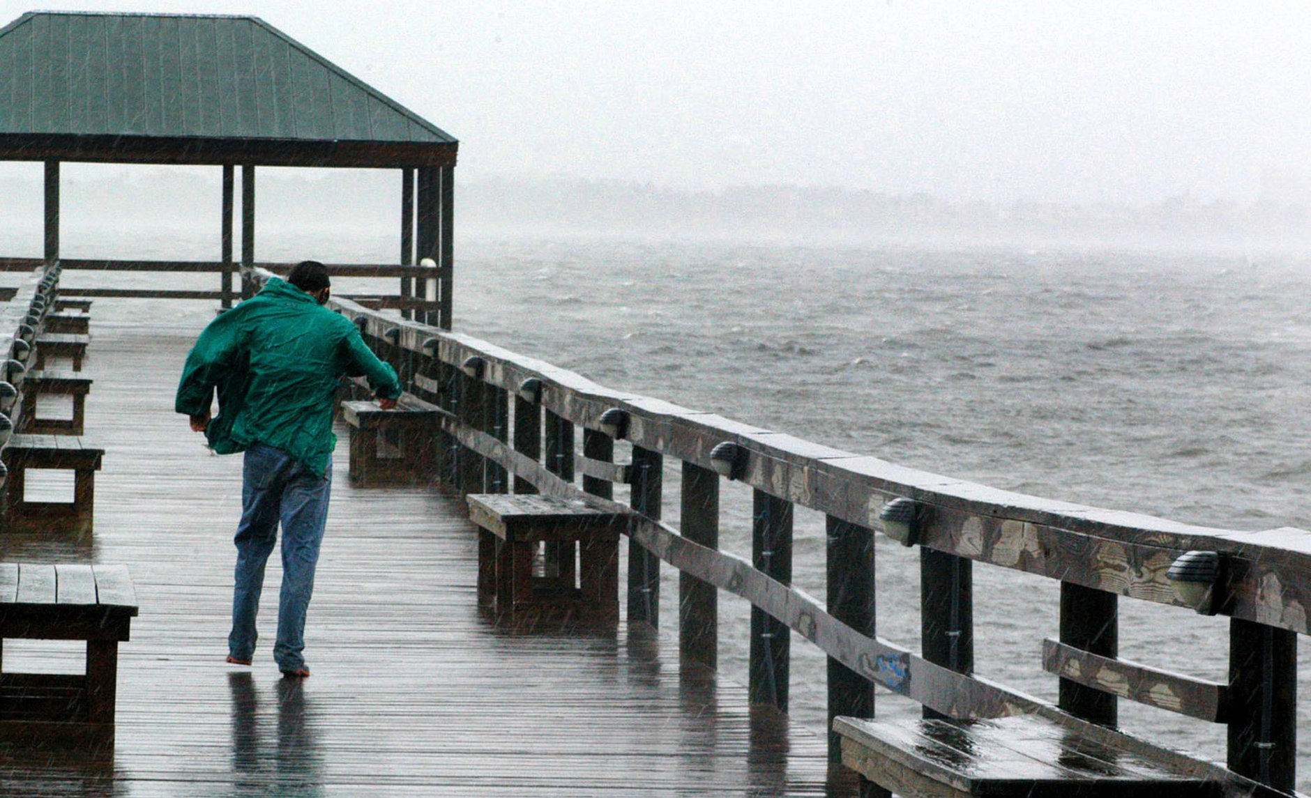 MELBURNE BEACH, FL - SEPTEMBER 4:  Rick Thomas down a pier on the the Indian River to watch the storm September 4, 2004 in Melbourne Beach, Florida. Hurricane Frances is a slow moving category 2 hurricane that is expected to affect Florida for days.  (Photo by Gerardo Mora/Getty Images)