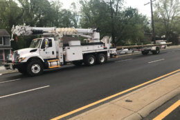 Replacement poles arrived on New Hampshire Avenue in Langley Park a little after 6 a.m. on Friday, however it might be a few hours before traffic completely re-opens. (WTOP/Neal Augenstein)
