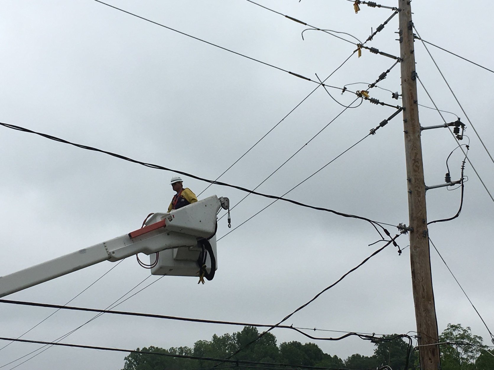Utility crews are also hard at work stabilizing light posts and fixing wires. (WTOP/Mike Murillo)