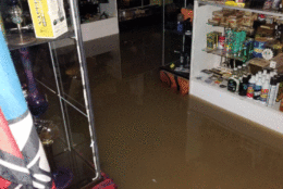 Standing water is seen inside the Peace of Sunshine shop on Frederick Road in Catonsville, Maryland, after severe flooding hit the area on May 27, 2018. (Melissa Howell/WTOP).
