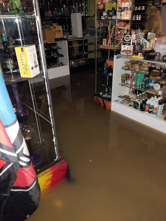 Standing water is seen inside the Peace of Sunshine shop on Frederick Road in Catonsville, Maryland, after severe flooding hit the area on May 27, 2018. (Melissa Howell/WTOP).