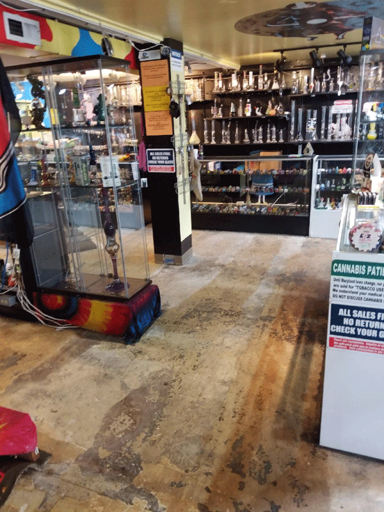 Cleanup continues inside the Peace of Sunshine shop on Frederick Road in Catonsville, Maryland, after severe flooding hit the area on May 27, 2018. (Melissa Howell/WTOP).