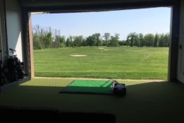 One of the indoor, second-level bays, looking out over the range. (WTOP/Noah Frank)