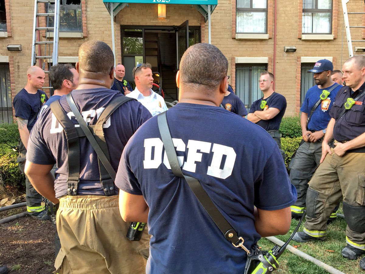 D.C. firefighters take part in a "hot wash" critique to learn lessons at the fire on Gainesville Street, SE. (Courtesy DC Fire and EMS)