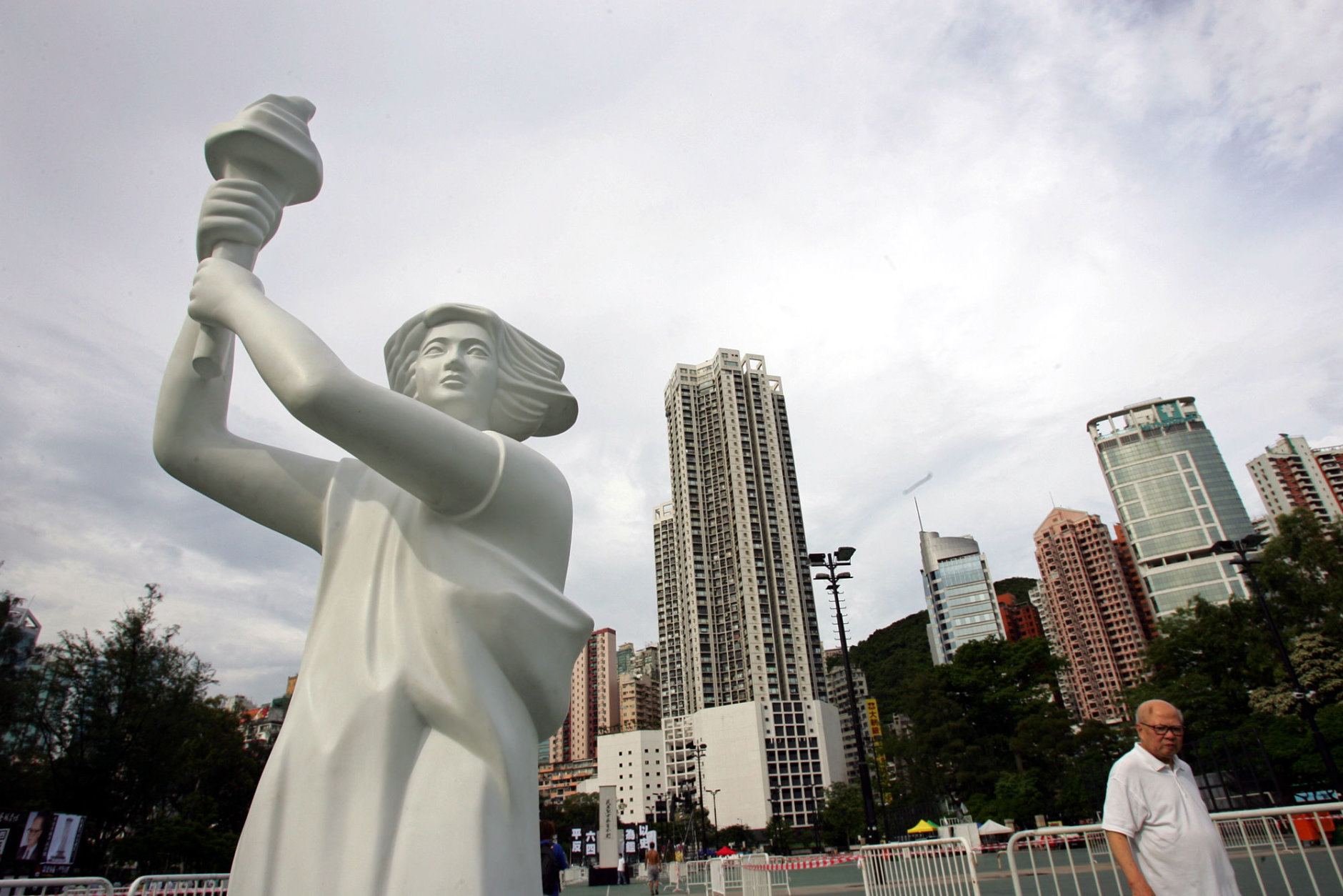 A statue of "Goddess of Democracy" is erected, marking the 16th anniversary of Tiananmen Square crackdown on students stands against the sky at Hong Kong's Victoria park Saturday, June 4, 2005. Tens of thousands of people are expected Friday night at the park for a candlelight vigil commemorating the Tiananmen Square incident and also demanding democracy for Hong Kong. (AP Photo/Vincent Yu)