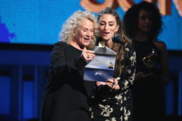 Carole King, left, and Sara Bareilles speak on stage at the 56th annual GRAMMY Awards at Staples Center on Sunday, Jan. 26, 2014, in Los Angeles. (Photo by Matt Sayles/Invision/AP)
