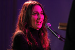 Under a pink stage light, singer Sara Bareilles performs her song, "Brave," for President Barack Obama, first lady Michelle Obama, Canadian Prime Minister Justin Trudeau and Sophie Grégoire Trudeau, in the State Dining Room of the White House in Washington, Thursday, March 10, 2016, after a State Dinner. (AP Photo/Jacquelyn Martin)