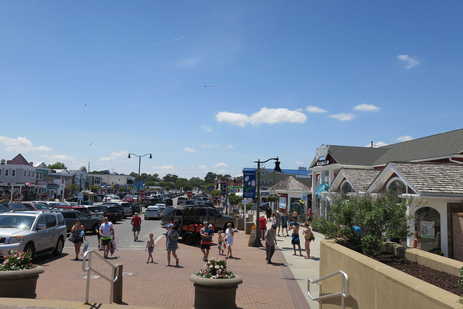 Bethany's main drag with cars parked is shown