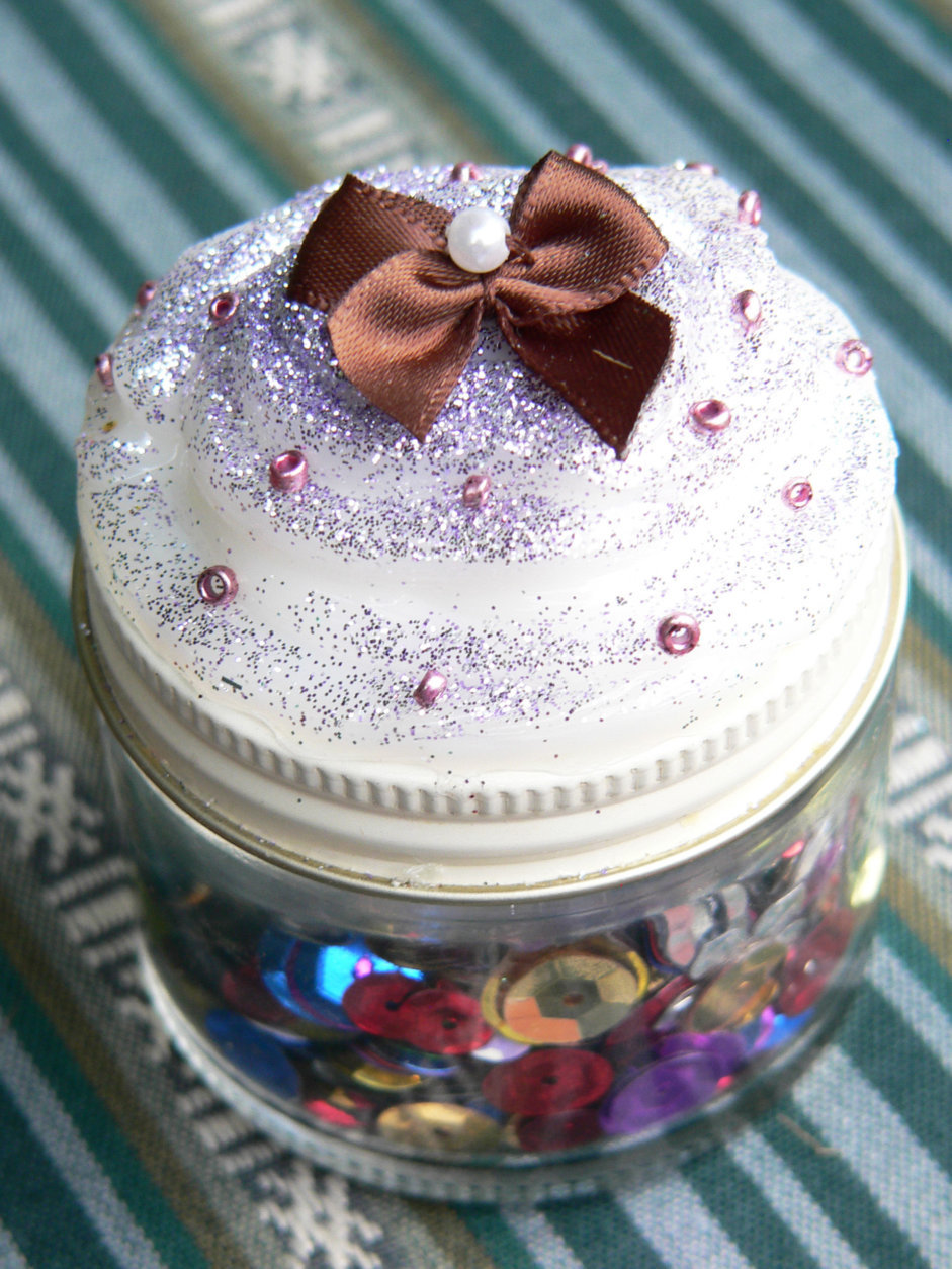 This Thursday, July 3, 2014 photo shows a faux cupcake crafted by teenagers in Arvada, Colo., that is a teen-approved craft found on Pinterest which involves piping white caulk atop squatty mason jars and decorating with glitter and faux gemstones. Crafting encourages creativity, develops imagination and counters the many hours teens spend on their computers, phones and other "screens." Activities such as crafting allow parents to connect with their teens in a healthy way. (AP Photo/Jennifer Forker)