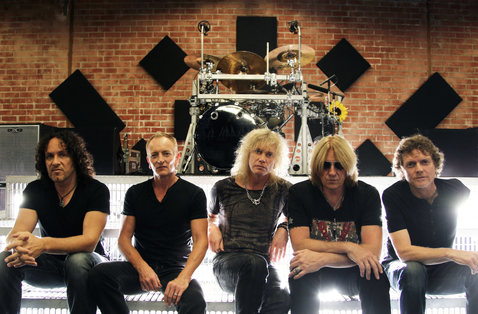 From left, Vivian Campbell, Phil Collen, Rick Savage, Joe Elliott, and Rick Allen, of musical group Def Leppard, pose for a portrait on Thursday, May 31, 2012 in Los Angeles. (Photo by Matt Sayles/Invision/AP)