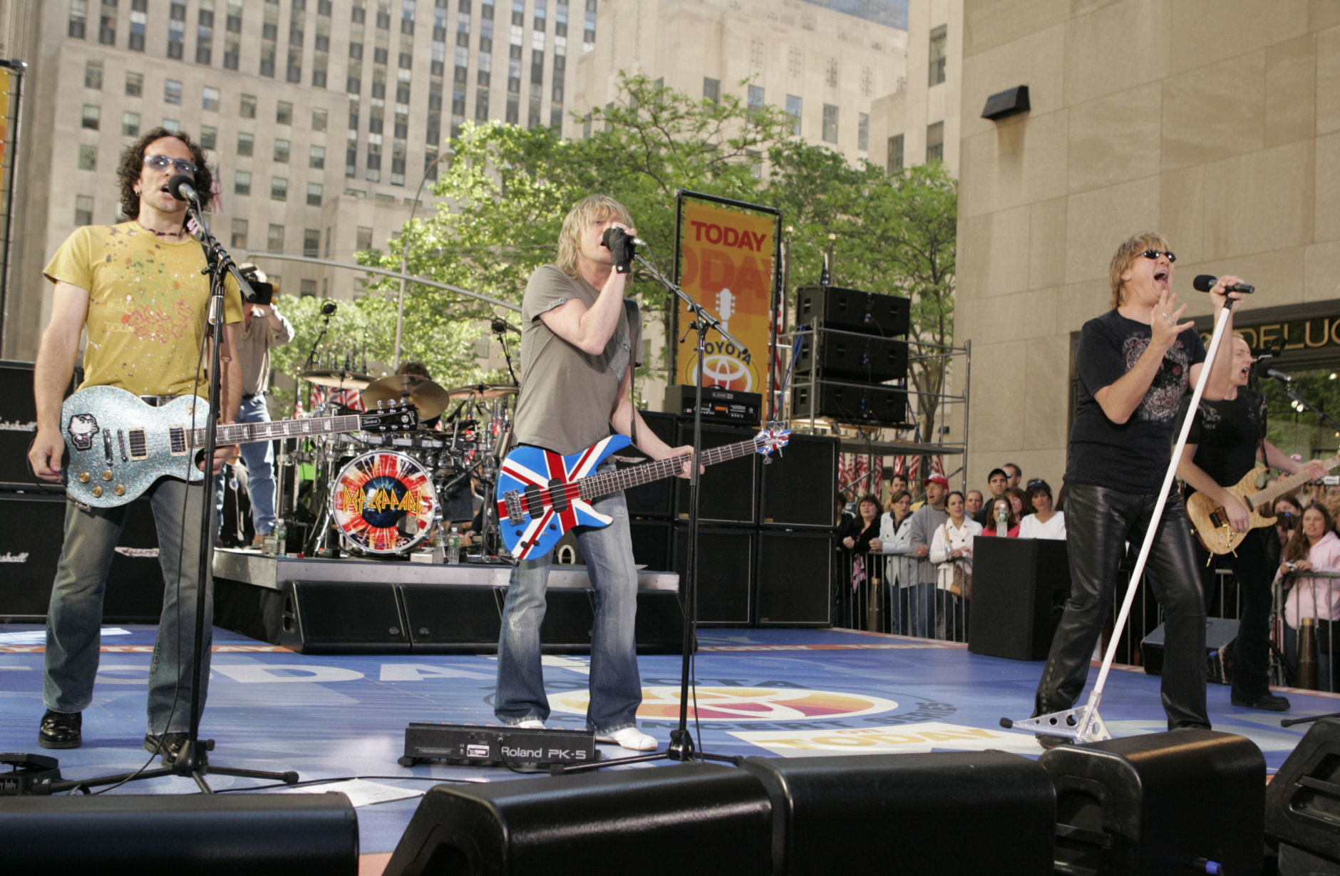 The band Def Leppard, from left, Viv Campbell,  Rick Savage, Joe Elliott and Phil Collen perform on NBC's "Today Show" Friday, May 27, 2005 in New York's Rockefeller Center. Drummer Rick Allen is hidden in background. Also on the bill was Bryan Adams who is touring with the band this summer.  (AP Photo/Julie Jacobson)